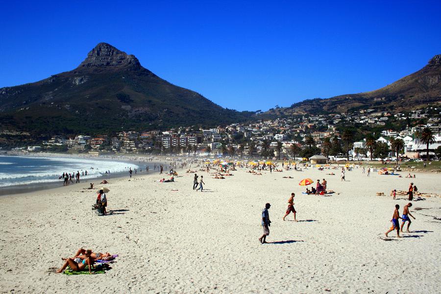 Camps Bay beach is backed by a palmtree-lined street filled with upmarket 