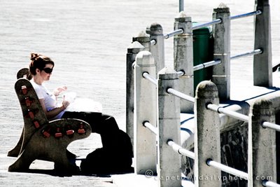 On a bench, eating lunch