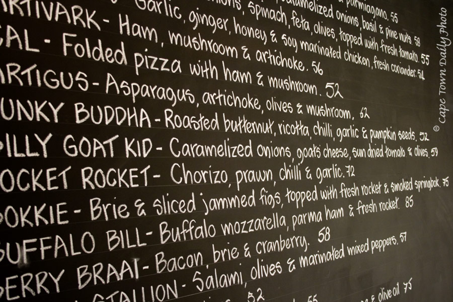 pizza menu on the wall.