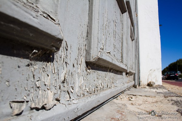 Sun, rain, and a door with flaking paint