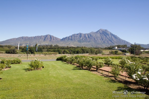 Mountains, blue sky and green grass