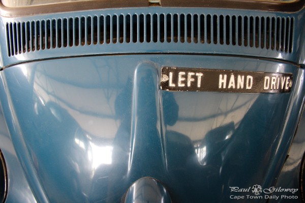 Car with a left hand drive sign