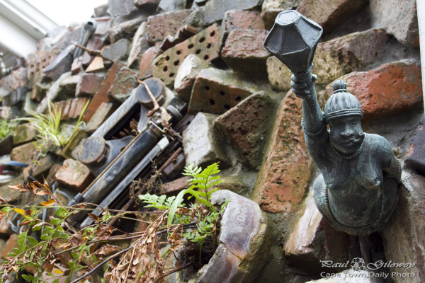 The Wall: A curios bare-breasted smoking figurehead