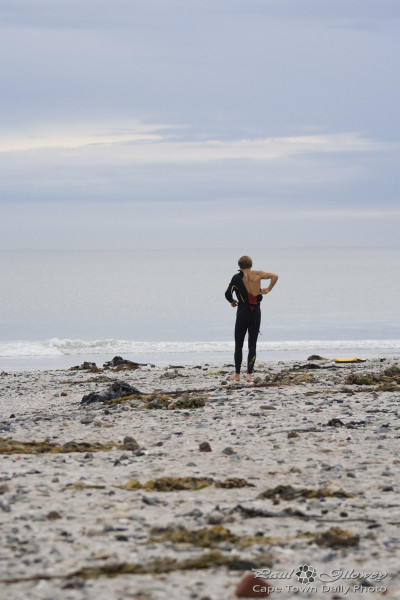 Surfers and clingy wetsuits